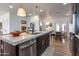 Bright kitchen showcasing a large island with seating and a stainless steel dishwasher, perfect for entertaining at 406 W Coolidge St, Phoenix, AZ 85013