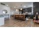 Stunning kitchen featuring sleek black cabinets, a stylish island, and modern stainless steel appliances at 406 W Coolidge St, Phoenix, AZ 85013