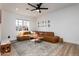 Bright living room featuring a cozy leather couch, a stylish rug, and an abundance of natural light at 406 W Coolidge St, Phoenix, AZ 85013