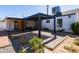 Covered patio with brick pavers, offering shade and a relaxing outdoor space at 406 W Coolidge St, Phoenix, AZ 85013