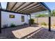 A spacious brick patio covered with a pergola at 406 W Coolidge St, Phoenix, AZ 85013