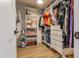 Organized walk-in closet with shelving, drawers, hanging rods, providing ample storage space for clothing and accessories at 406 W Coolidge St, Phoenix, AZ 85013