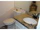 Bathroom featuring a toilet, white cabinets, and a sink with granite countertops at 4150 E Harvard Ave, Gilbert, AZ 85234