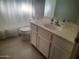 Bathroom with a white vanity, sink, and tile flooring at 4150 E Harvard Ave, Gilbert, AZ 85234