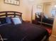 Cozy bedroom with a plush bed and mirrored closet doors at 4150 E Harvard Ave, Gilbert, AZ 85234