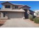 Exterior of a charming two-story home with a front-facing two car garage at 4150 E Harvard Ave, Gilbert, AZ 85234