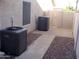 Side yard area with air conditioning units and convenient access to the backyard at 4150 E Harvard Ave, Gilbert, AZ 85234