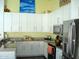 Well-lit kitchen with white cabinetry, granite countertops, and stainless steel appliances at 4150 E Harvard Ave, Gilbert, AZ 85234