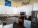 Bright kitchen featuring white cabinets, stainless steel appliances, and granite countertops at 4150 E Harvard Ave, Gilbert, AZ 85234