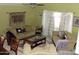 Cozy living room with comfortable seating, a ceiling fan, and lots of space at 4150 E Harvard Ave, Gilbert, AZ 85234