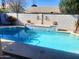 Inviting pool featuring a decorative water feature and well-maintained surroundings at 4150 E Harvard Ave, Gilbert, AZ 85234