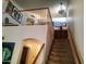 Staircase leading to an open loft area with natural light and modern design at 4150 E Harvard Ave, Gilbert, AZ 85234