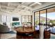 Bright living room featuring high ceilings, modern furniture, and large windows with beautiful outdoor views at 42690 N 98Th Pl, Scottsdale, AZ 85262