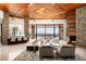 Open concept living area with stone columns, wood ceiling, fireplace and expansive views at 42690 N 98Th Pl, Scottsdale, AZ 85262