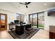 Well-lit office space with a modern desk, neutral colors, and large windows with scenic outdoor views at 42690 N 98Th Pl, Scottsdale, AZ 85262