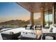 Comfortable outdoor patio seating area with picturesque mountain views and desert landscaping at 42690 N 98Th Pl, Scottsdale, AZ 85262
