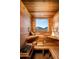 Relaxing wooden sauna with built-in seating, mountain views, and traditional sauna accessories at 42690 N 98Th Pl, Scottsdale, AZ 85262