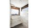 Walk-in shower with bench and marble tiling has an exterior window with scenic views at 42690 N 98Th Pl, Scottsdale, AZ 85262