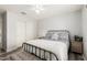 Bedroom featuring a ceiling fan, wood-look floors, and a large closet at 45713 W Dutchman Dr, Maricopa, AZ 85139