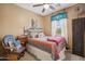 Inviting bedroom with eclectic decor and rustic charm at 4769 E Thunderheart Trl # 101, Gilbert, AZ 85297