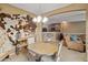 Cozy dining area with unique decor, open to kitchen and living space at 4769 E Thunderheart Trl # 101, Gilbert, AZ 85297