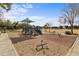 Community playground featuring playground equipment and benches at 4769 E Thunderheart Trl # 101, Gilbert, AZ 85297