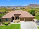 Lovely desert home with lush backyard grass and landscaping near mountain views at 6044 E Hodges St, Cave Creek, AZ 85331