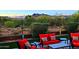 Inviting backyard seating area with comfortable red cushions and stunning mountain views at 6044 E Hodges St, Cave Creek, AZ 85331