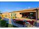 Large covered patio with outdoor furniture and views of the landscaped backyard at 6044 E Hodges St, Cave Creek, AZ 85331
