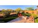 Inviting backyard featuring artificial turf, stone fire pit, and mountain views at 6044 E Hodges St, Cave Creek, AZ 85331