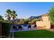 Scenic backyard with pool, mountain views, artificial turf, and desert landscaping at 6044 E Hodges St, Cave Creek, AZ 85331