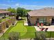 Beautiful backyard with a putting green, fire pit, and outdoor seating area, perfect for entertaining at 6044 E Hodges St, Cave Creek, AZ 85331