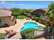 Inviting backyard featuring a sparkling pool, spa, and a cozy lounge area with comfortable seating at 6044 E Hodges St, Cave Creek, AZ 85331