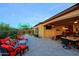 Covered outdoor patio featuring ample seating, dining and lounging, and a well-manicured lawn at 6044 E Hodges St, Cave Creek, AZ 85331