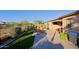 Spacious backyard featuring lush artificial turf, desert landscaping, and outdoor grill at 6044 E Hodges St, Cave Creek, AZ 85331