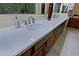 Bathroom vanity featuring a light countertop, dual sinks, and cabinets at 6044 E Hodges St, Cave Creek, AZ 85331