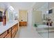 A luxurious bathroom with dual vanities, a soaking tub, and a glass-enclosed shower at 6044 E Hodges St, Cave Creek, AZ 85331