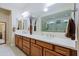 Bright bathroom featuring double sinks, sleek countertops, and modern fixtures plus a glass shower at 6044 E Hodges St, Cave Creek, AZ 85331