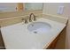 Close up of bathroom sink with stylish faucet, light countertop, and cream colored wall at 6044 E Hodges St, Cave Creek, AZ 85331