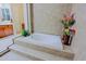 A luxurious bathroom with a soaking tub and decorative plants at 6044 E Hodges St, Cave Creek, AZ 85331
