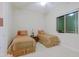 Cozy bedroom with two beds, soft carpet, and ample natural light at 6044 E Hodges St, Cave Creek, AZ 85331