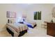 Well-lit bedroom with twin beds, stylish bedding, neutral walls, and a serene ambiance at 6044 E Hodges St, Cave Creek, AZ 85331