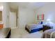 Tastefully decorated bedroom features twin beds, neutral walls and carpet, and a view of the bath at 6044 E Hodges St, Cave Creek, AZ 85331