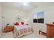 Bedroom features a comfortable bed, window offering natural light, and tasteful decor at 6044 E Hodges St, Cave Creek, AZ 85331