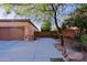 Charming home exterior featuring a well-maintained lawn, desert landscaping, and a spacious driveway at 6044 E Hodges St, Cave Creek, AZ 85331