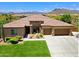Beautiful single-story home featuring a three-car garage, desert landscaping and gorgeous mountain views at 6044 E Hodges St, Cave Creek, AZ 85331