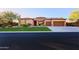 Charming single-story home with manicured lawn, desert landscaping, and attached garage at 6044 E Hodges St, Cave Creek, AZ 85331