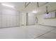 Expansive garage featuring bright lighting and extensive storage cabinets along the walls at 6044 E Hodges St, Cave Creek, AZ 85331