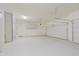 Spacious garage with epoxy flooring, built-in storage cabinets, and ample room for vehicles and projects at 6044 E Hodges St, Cave Creek, AZ 85331