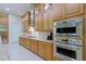 Well-equipped kitchen featuring stainless steel appliances, granite counters, and ample cabinet space at 6044 E Hodges St, Cave Creek, AZ 85331
